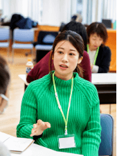 asian woman speaking while gesturing